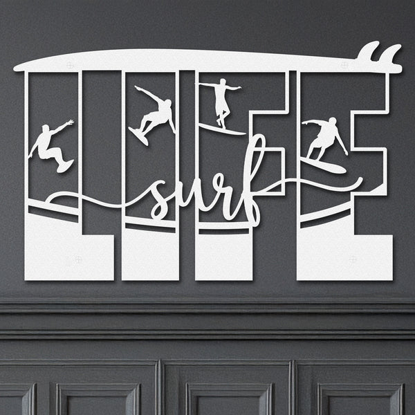 White decorative metal wall art featuring the word 'LIFE' with silhouettes of surfers in various poses within each letter, and the word 'surf' written in cursive script in the center.