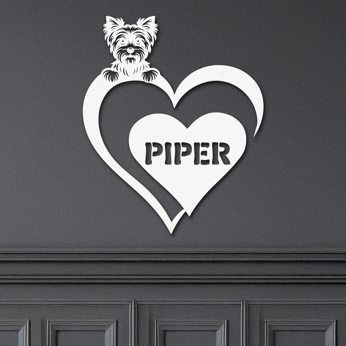 White metal sign featuring a yorkie and a heart-shaped name plaque, displayed on a dark background.