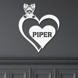 White metal sign featuring a yorkie and a heart-shaped name plaque, displayed on a dark background.