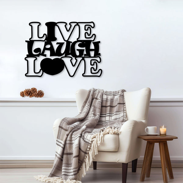 Black metal wall decor with the phrase 'Live Laugh Love' displayed above an armchair with a plaid blanket.