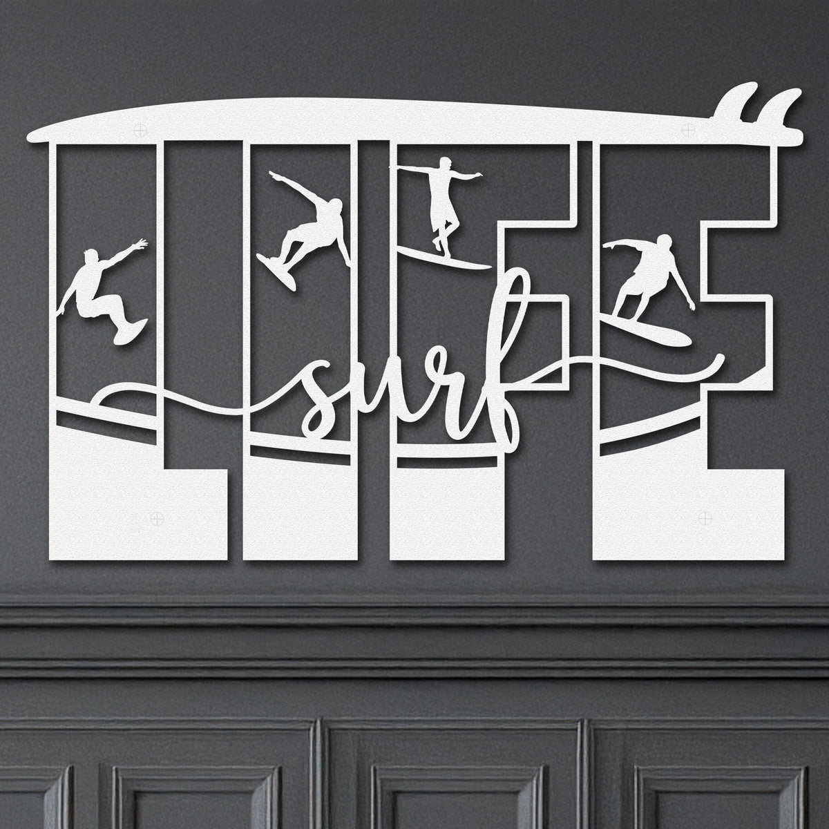 White decorative metal wall art featuring the word 'LIFE' with silhouettes of surfers in various poses within each letter, and the word 'surf' written in cursive script in the center.