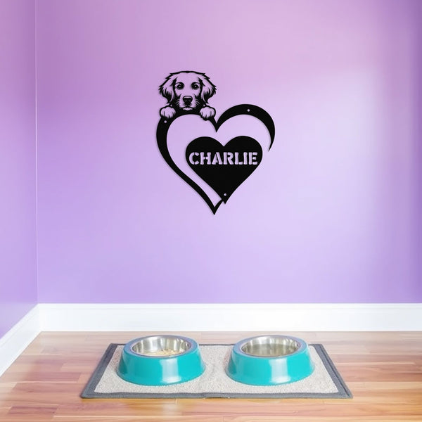 Personalized metal sign featuring a golden retriever and a heart-shaped name plaque, displayed on a purple wall above dog bowls.